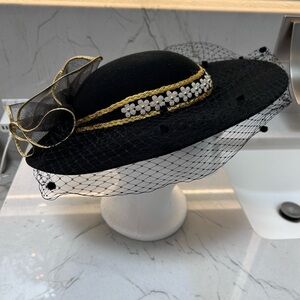 Black Hat with Gold and Silver Trim, Gold and Black Bow and Black Netted Veil